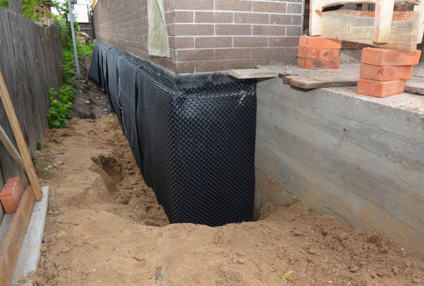 Happy homeowners after waterproofing job in New Haven